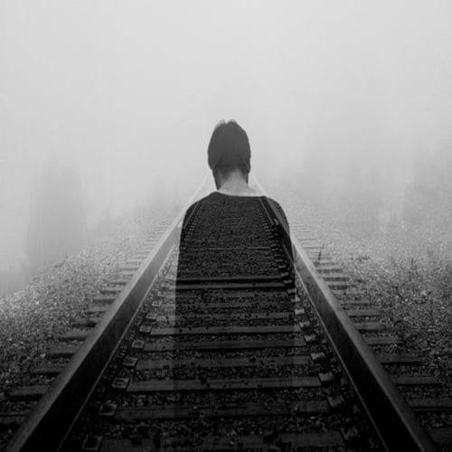 alone boy on railway track